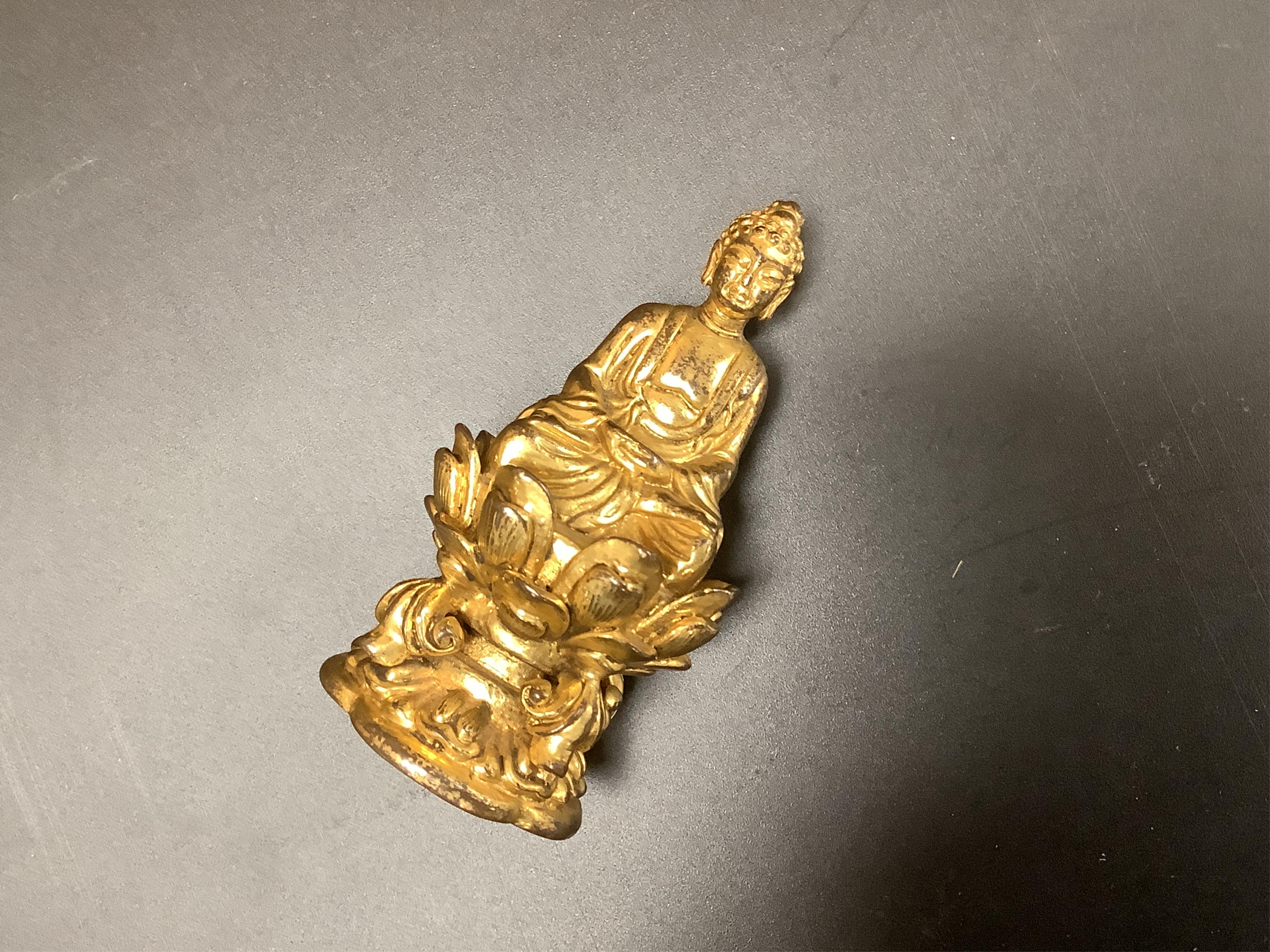 A Chinese miniature gilt metal figure of seated Buddha, 8cm high